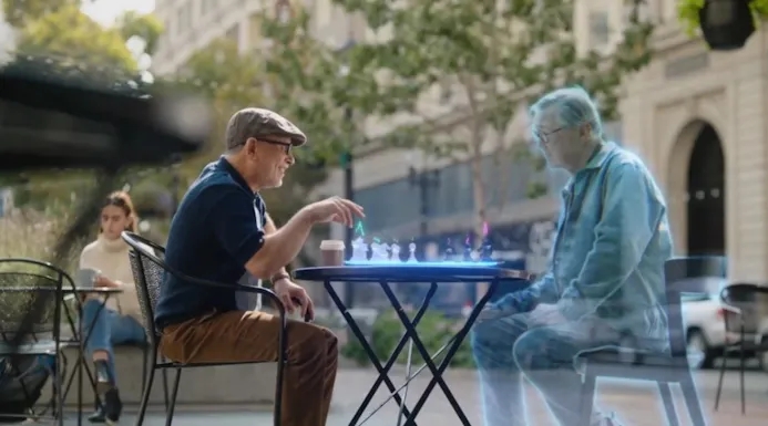 Promotioneel voorbeeld van de Metaverse van Facebook; een man schaakt met een holografische tegenstander op een virtueel schaakbord.